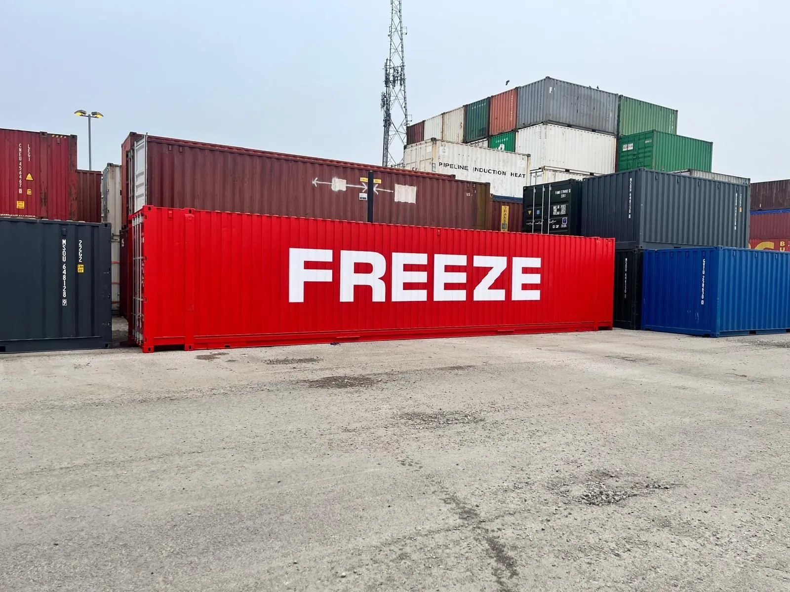Shipping container freshly repainted in bright red at the Container Care workshop