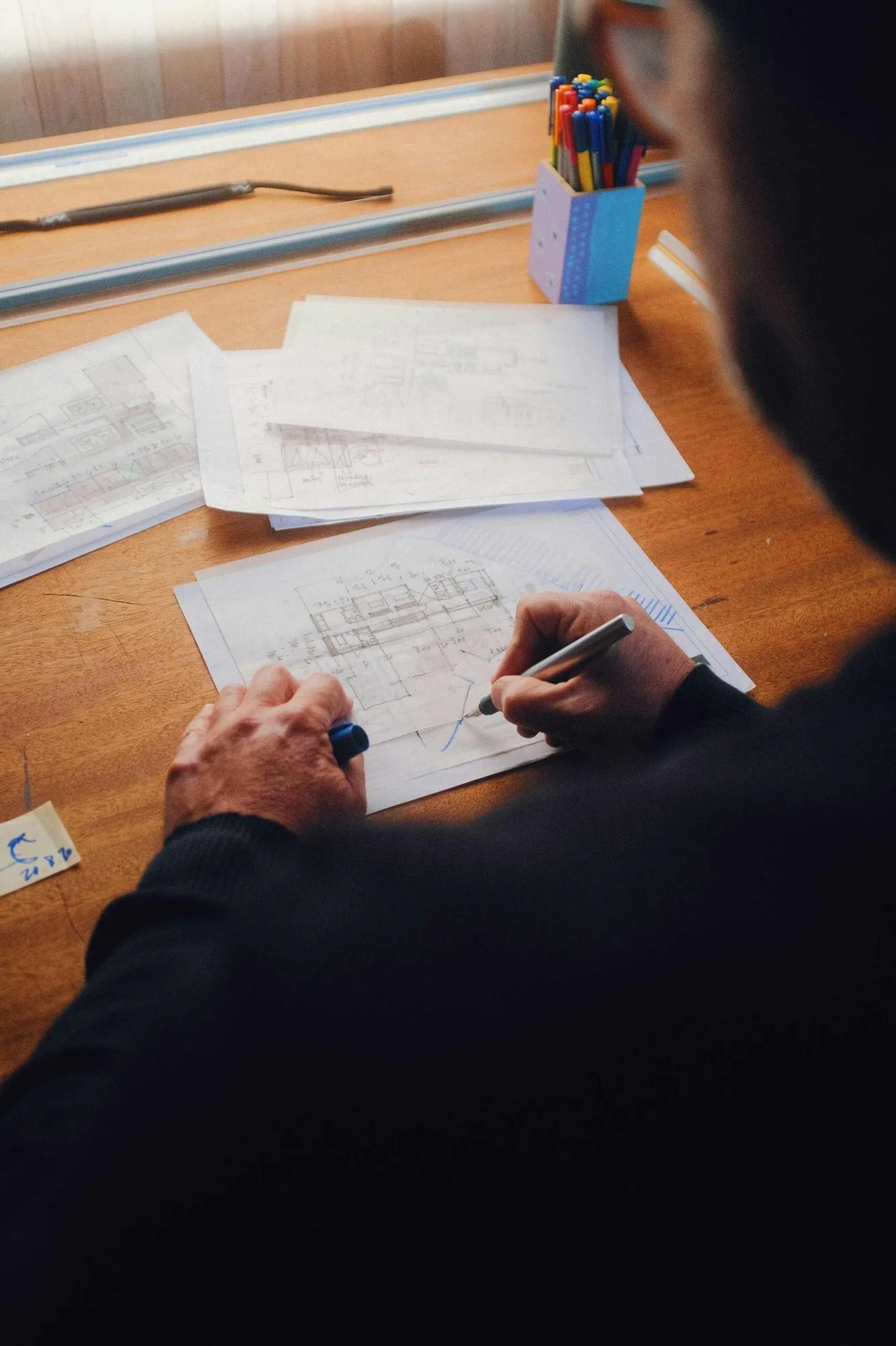 Hand-drafting plans for a container conversion at the design stage